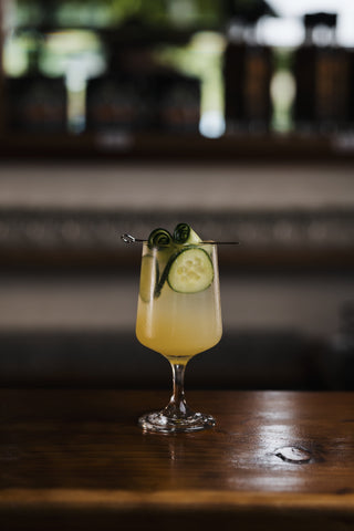 Visually striking Homemade Lemonade, garnished with cucumber rolls