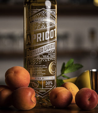 Apricot Liqueur label close up with fresh ripe apricots