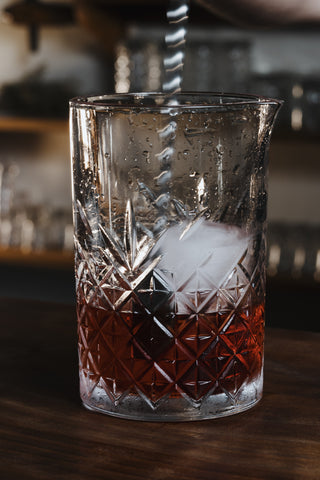 Stirring the Boulevardier cocktail