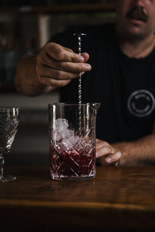 Boysenberry Gin Fizz stirred on the bar