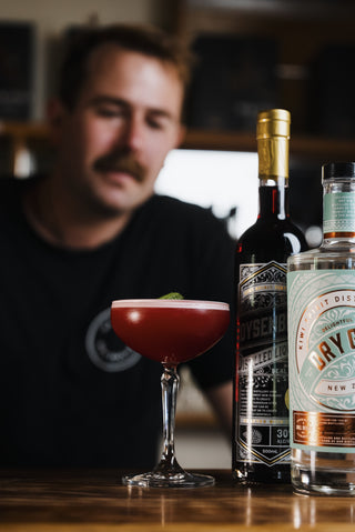 Boysenberry Sour with Jeremy in background