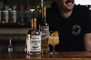 Championz on the bar with The Adriaan cocktail and Apricot Liqueur