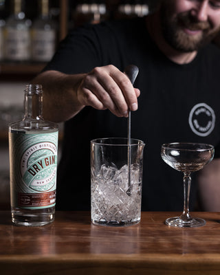 Stirring the Delightful Dry Martini cocktail