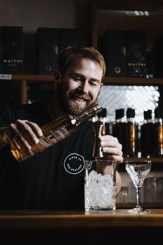 Jeremy pours the lime liqueur