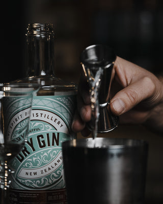 Pouring the Delightful Dry Gin into the Golden Bay Glow