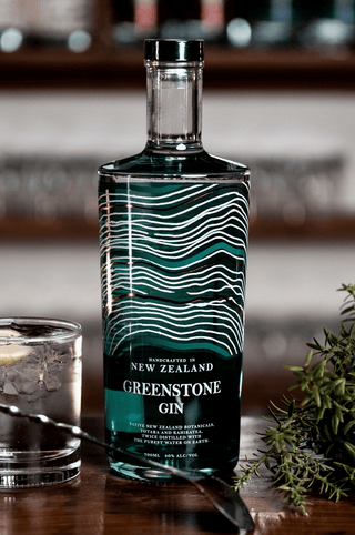 Greenstone New Zealand Gin with Totara branch and a gin and tonic