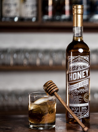 Honey Liqueur of centre with honey liqueur drink in the centre frame