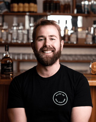 Jeremy at the cellar door bar smiling for a picture