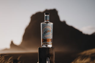 Premium Vodka at sunset on the sandy beach