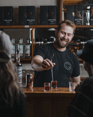 Jeremy stiring a tasting cocktail in the cellar door