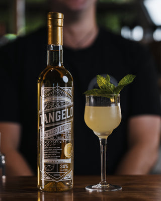 Tangelo Smash with tangelo liqueur bottle