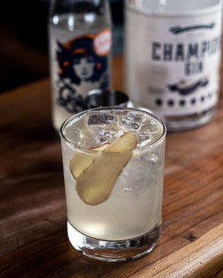 Close up of the GG cocktail with fresh ginger garnish