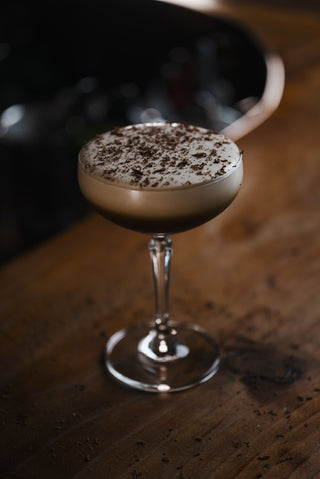 Stunning espresso martini served in a martini glass with a ombre foam. Chocolate grated across the top