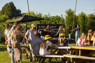 Kiwi Spirit's Garden Party crowd enjoying music in the sun