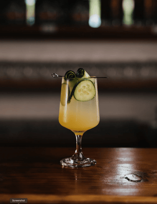 Visually striking Homemade Lemonade, garnished with cucumber rolls 