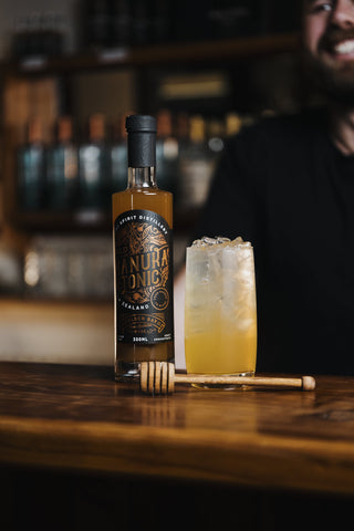 A large bold dried orange round garnishes this cocktail of vodka and Wild Manuka Tonic