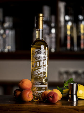 Apricot Liqueur with fresh apricots on a wooden bar
