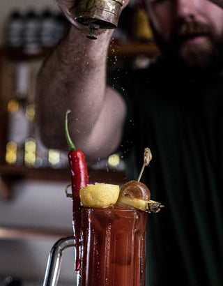 Pepper onto the bloody mary cocktail