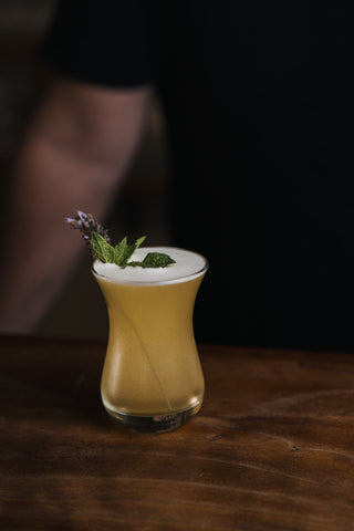 Botanist cocktail on wooden bar