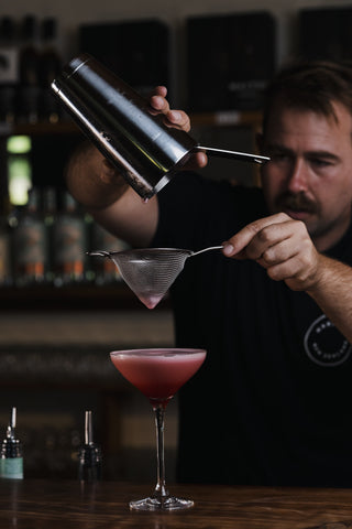 Clover Club through sieve into martini glass