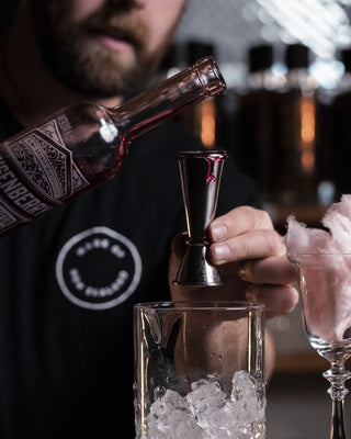 Pouring Boysenberry Liqueur into glass