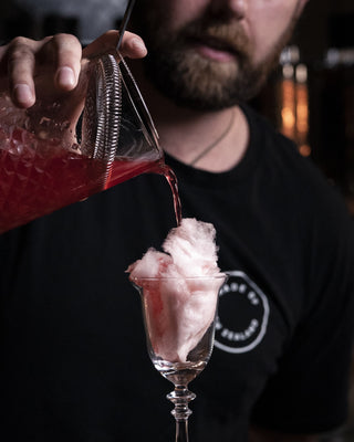 Melting the Cotton Candy Brandy as poured into glass