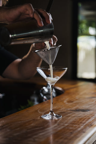 Delightful Tangelo Sour poured into martini glass