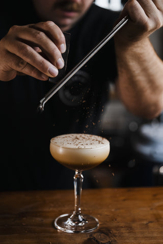 Top the Espresso Martini with chocolate