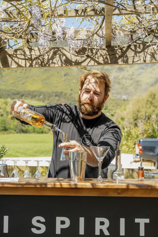 Jeremy pouring Tangelo Liqueur at a Garden Party