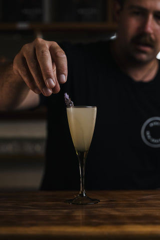 Lavender sprig placed into Katinka cocktail