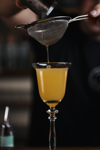 Mayfair cocktail poured into glass