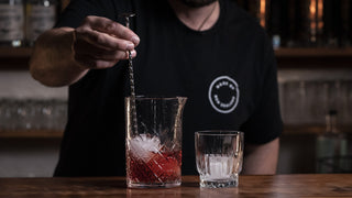 Wide image of the negroni cocktail stirred 