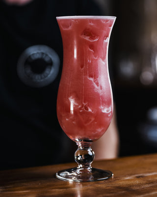 Pink Pussycat on wooden bar, pink cocktail