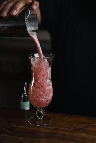 Pink Pussycat cocktail poured into cocktail glass