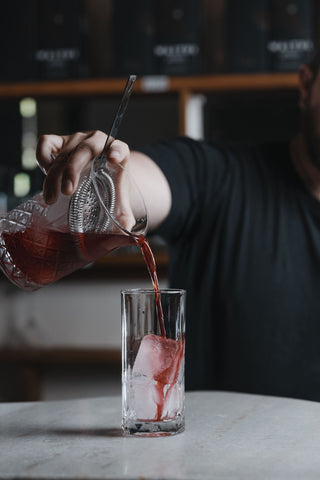 Spring Punch poured over large ice cube 