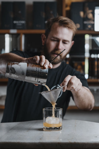 Jeremy pouring Summer Lovin over ice cube