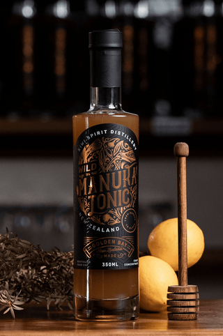 Wild Manuka Tonic on a wooden bar with lemons and honey